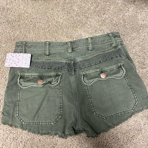 Free People High Rise Raw Shorts in Moss